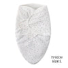 White cotton newborn swaddle blanket and hat set with small black and pink dots