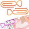 Two orange and pink heart-shaped clips for diamond painting canvas