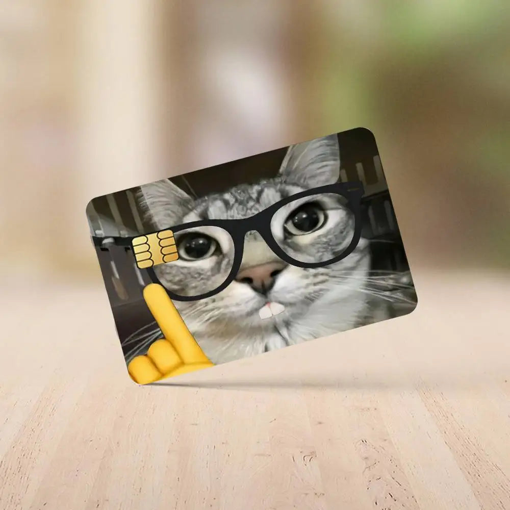 A photo of a cat wearing black glasses and a yellow thumbs-up sign, used as a meme sticker.