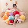 A collection of soft, colorful mushroom plush pillows in various shades are arranged on a light-colored sofa.