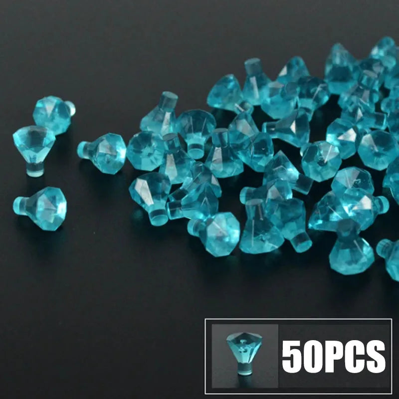 A pile of bright blue gemstone building blocks, including various shapes and sizes, with a small box showing 50 pieces.