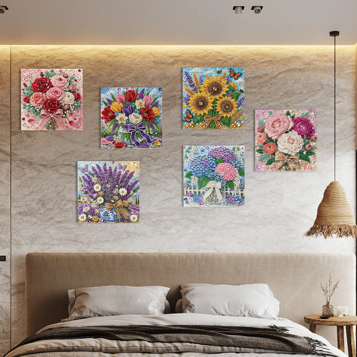 A bedroom wall decorated with framed floral paintings above a bed.