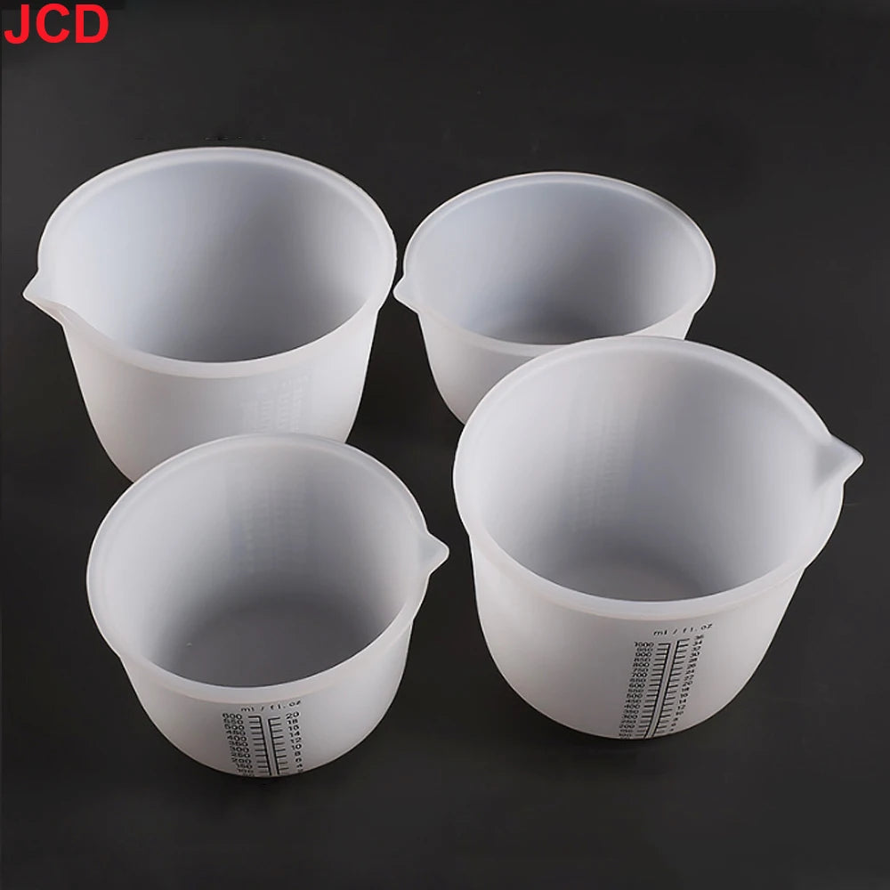 Four white flexible silicone measuring cups for resin and epoxy