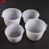 Four white flexible silicone measuring cups for resin and epoxy