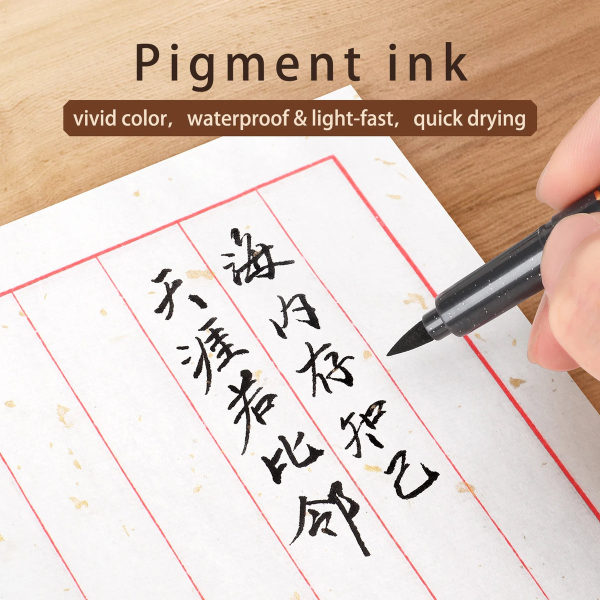 A hand writes Chinese calligraphy on paper using a black pigment ink pen.