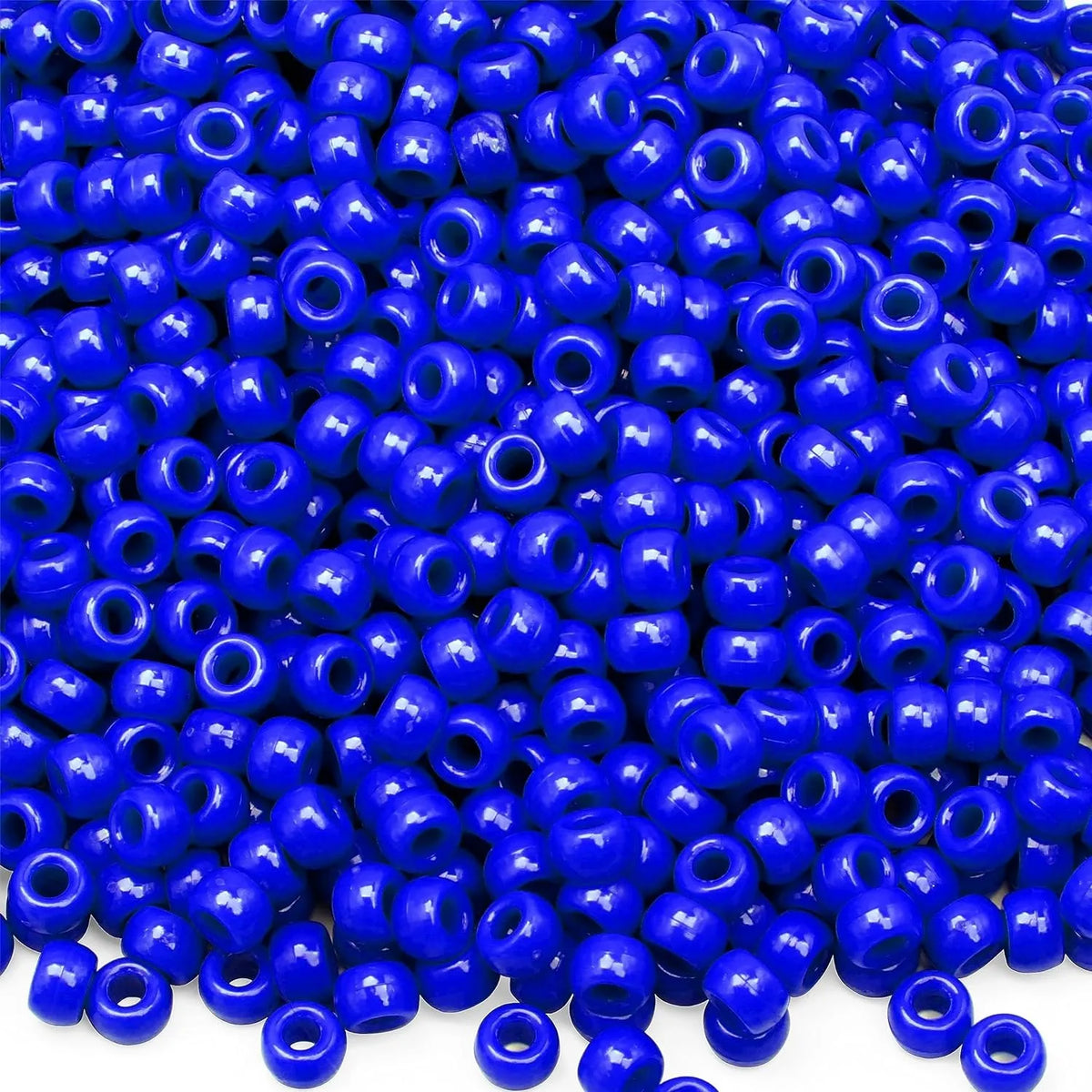 A pile of small blue pony beads for jewelry, braids, and crafts.