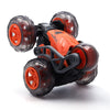 Black and orange stunt car with five transparent wheels ready for action.