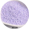 A pile of small, round, purple glass seed beads for jewelry and craft.