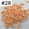 A pile of 1000 small, round, orange fuse beads for creative craft projects.