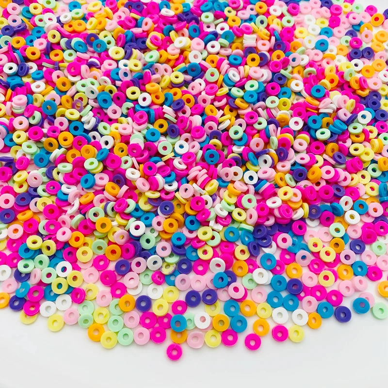 A pile of colorful polymer clay star and heart sprinkles in various bright colors like pink, yellow, blue, and green.