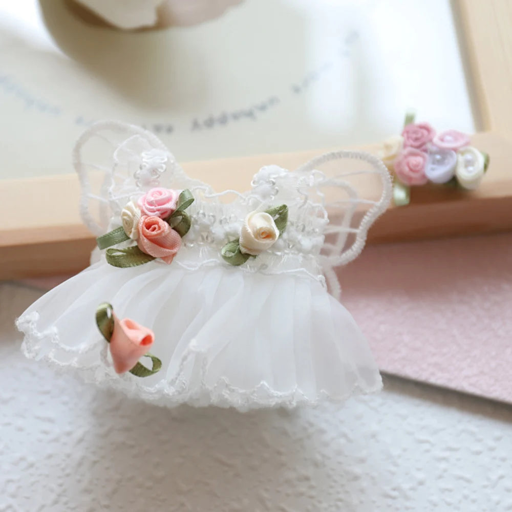 A white mini doll wedding dress outfit set featuring floral embroidery and sheer fabric.