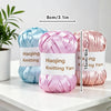 A set of nine colored satin ribbon knitting yarn skeins displayed on a white surface.