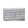 A purple and white chevron patterned portable waterproof baby changing mat with a gray carry handle.