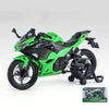 A green Kawasaki Ninja motorcycle diecast model with lights and sound displayed on a white background.