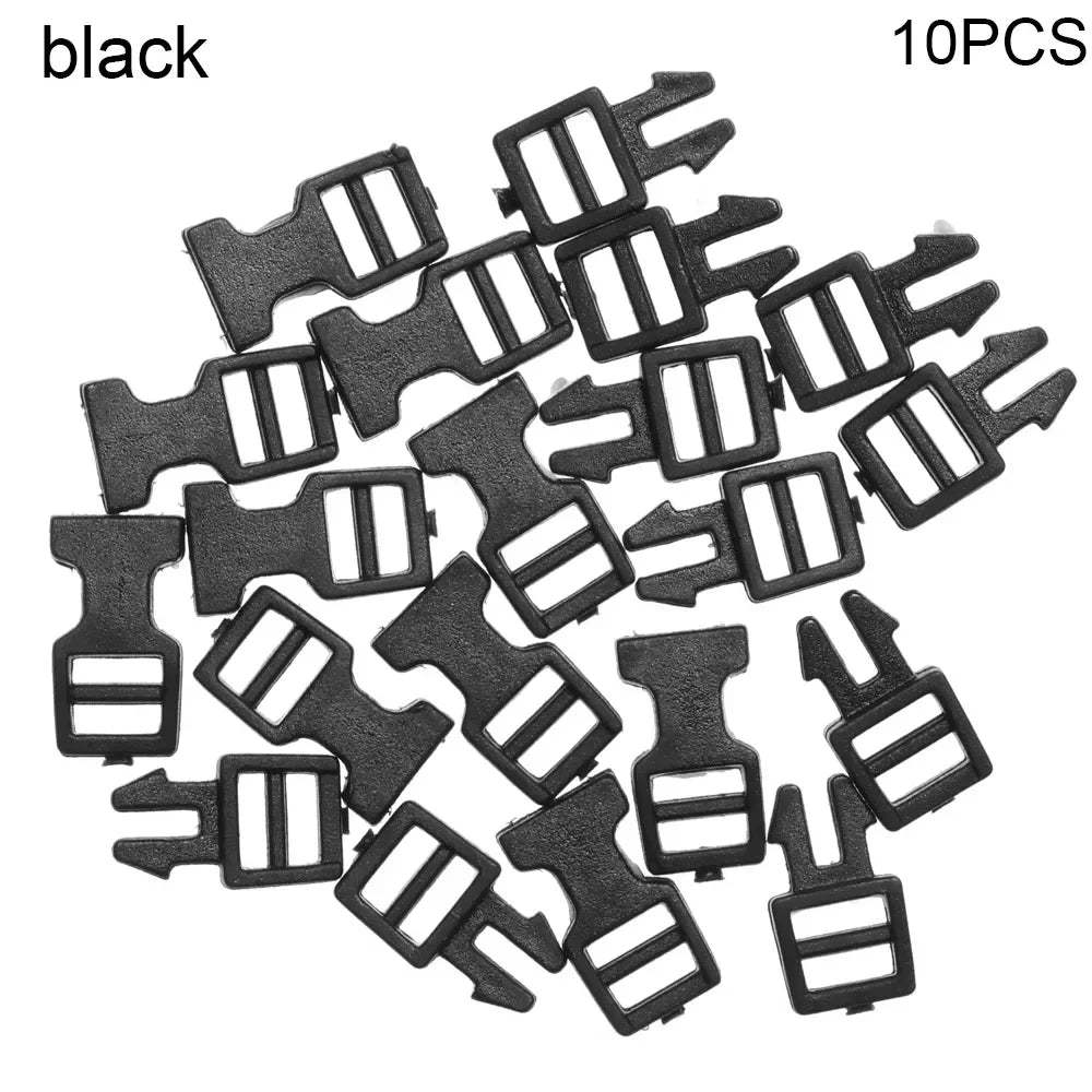 A pile of ten black mini plastic buckles for DIY crafts and outdoor gear.