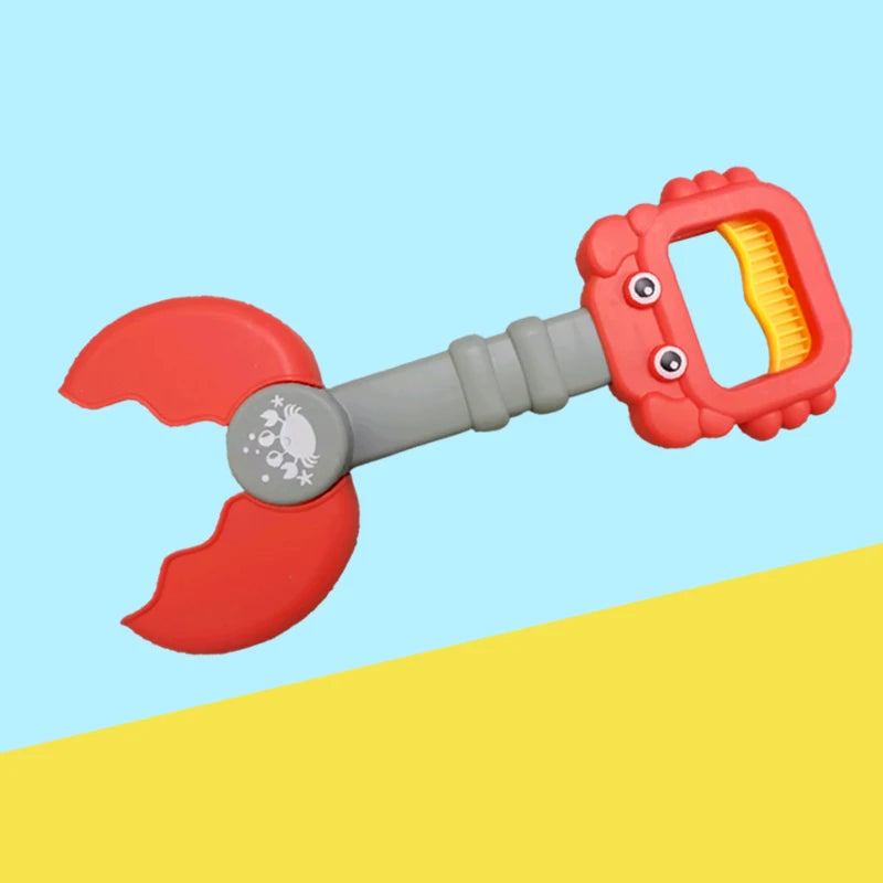 A red kids beach toy set featuring crab claw pliers and dinosaur digging tools against a light blue background.