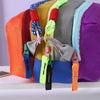 A colorful alpaca themed travel storage bag with three zippered compartments in orange, yellow, gray, and purple.