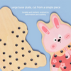 A large wooden plate shaped like a rabbit is shown next to a piece of light wood, demonstrating durability and resilience.