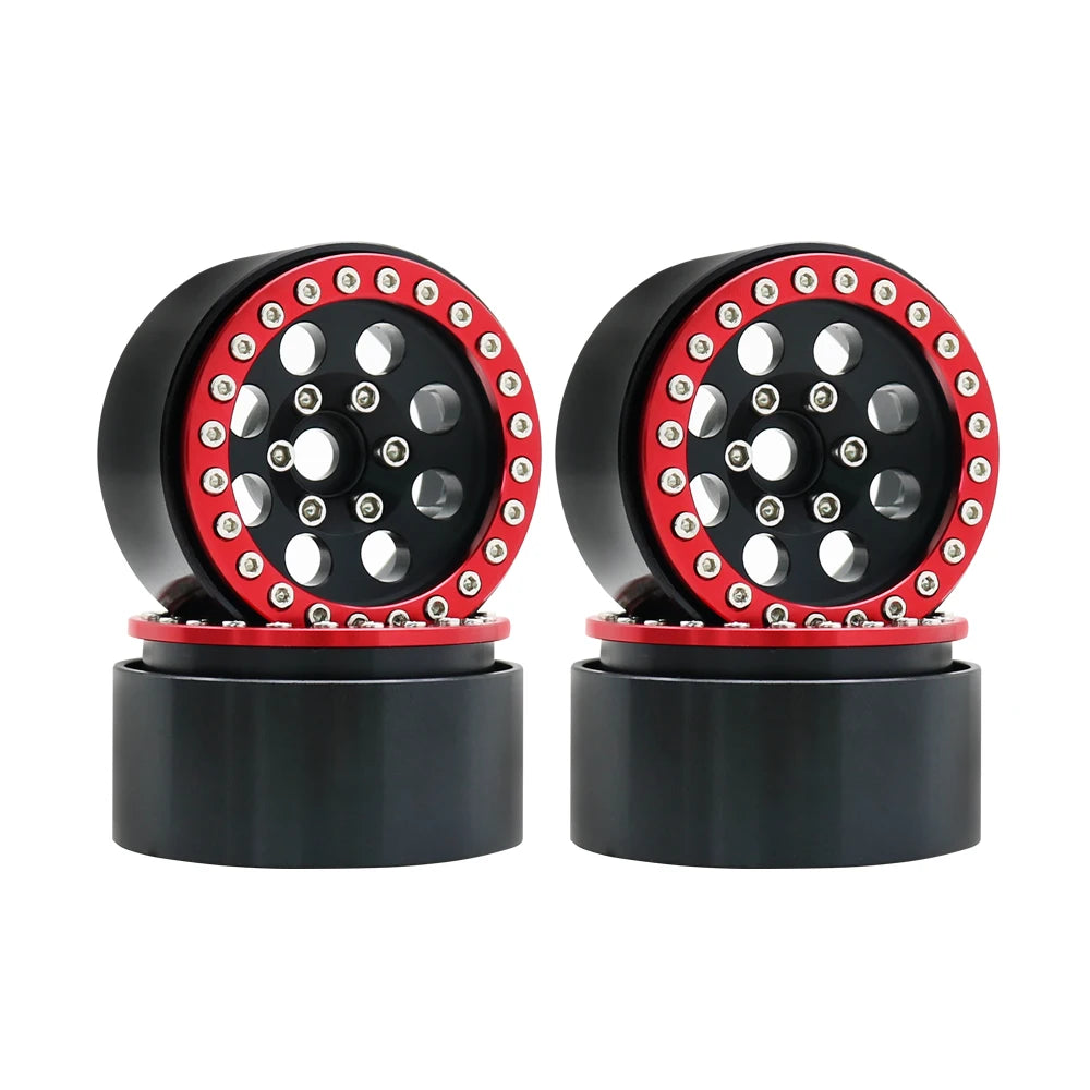 A pair of black beadlock wheels with red accents and removable hex hubs for an RC crawler.