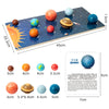 Wooden solar system puzzle featuring eight planets in various sizes and colors on a dark blue board