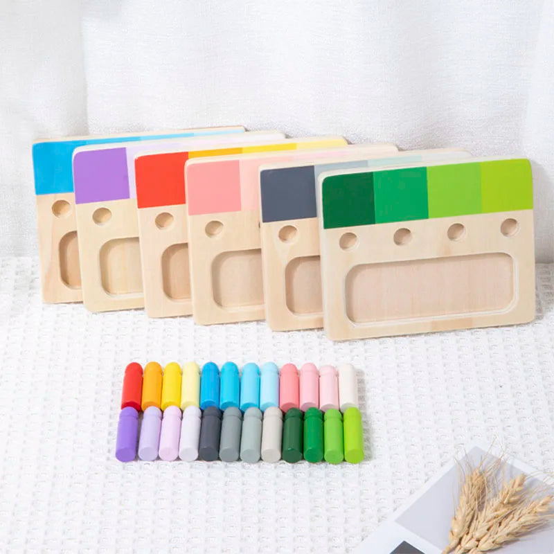A set of wooden color matching blocks in various colors arranged in a row on a white surface.