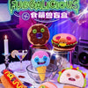A collection of cute monster-themed food items and plush toys including a donut, a sandwich, an ice cream, and a pink monster
