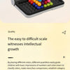 A black tray holds colorful plastic beads arranged in a pyramid shape for a logic puzzle.