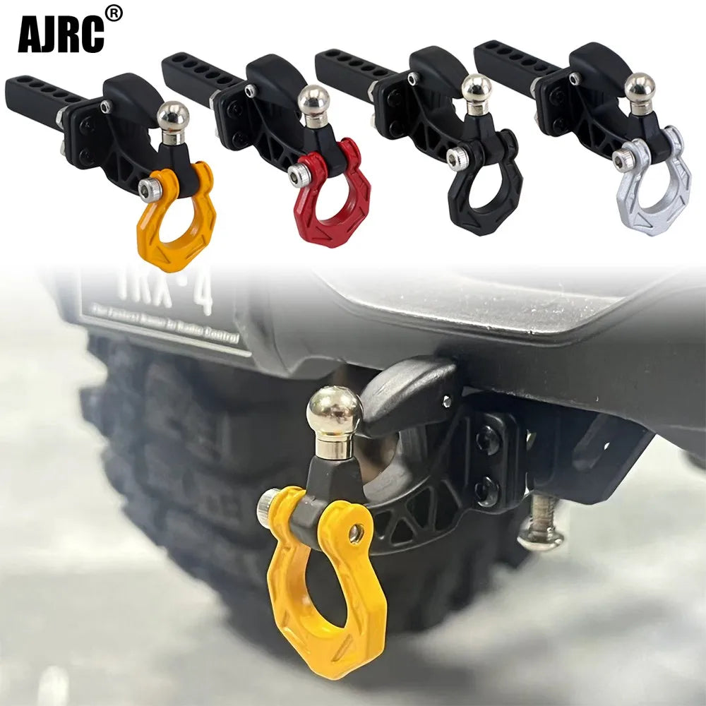 Metal trailer hitch receiver for RC crawler cars showing various colored metal clamps.