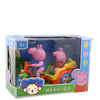 A pink piggy ride-on toy car with music inside its packaging box.
