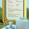 A yellow product information sign displays a Deluxe Pretend Play Picnic & Tea Party Set for Kids including a woven basket, te