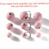 A collection of matte pink acrylic round beads of various sizes and diameters.