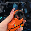An orange magnetic fidget card with a rotating ratchet mechanism is held in a hand against a dark, technical background.