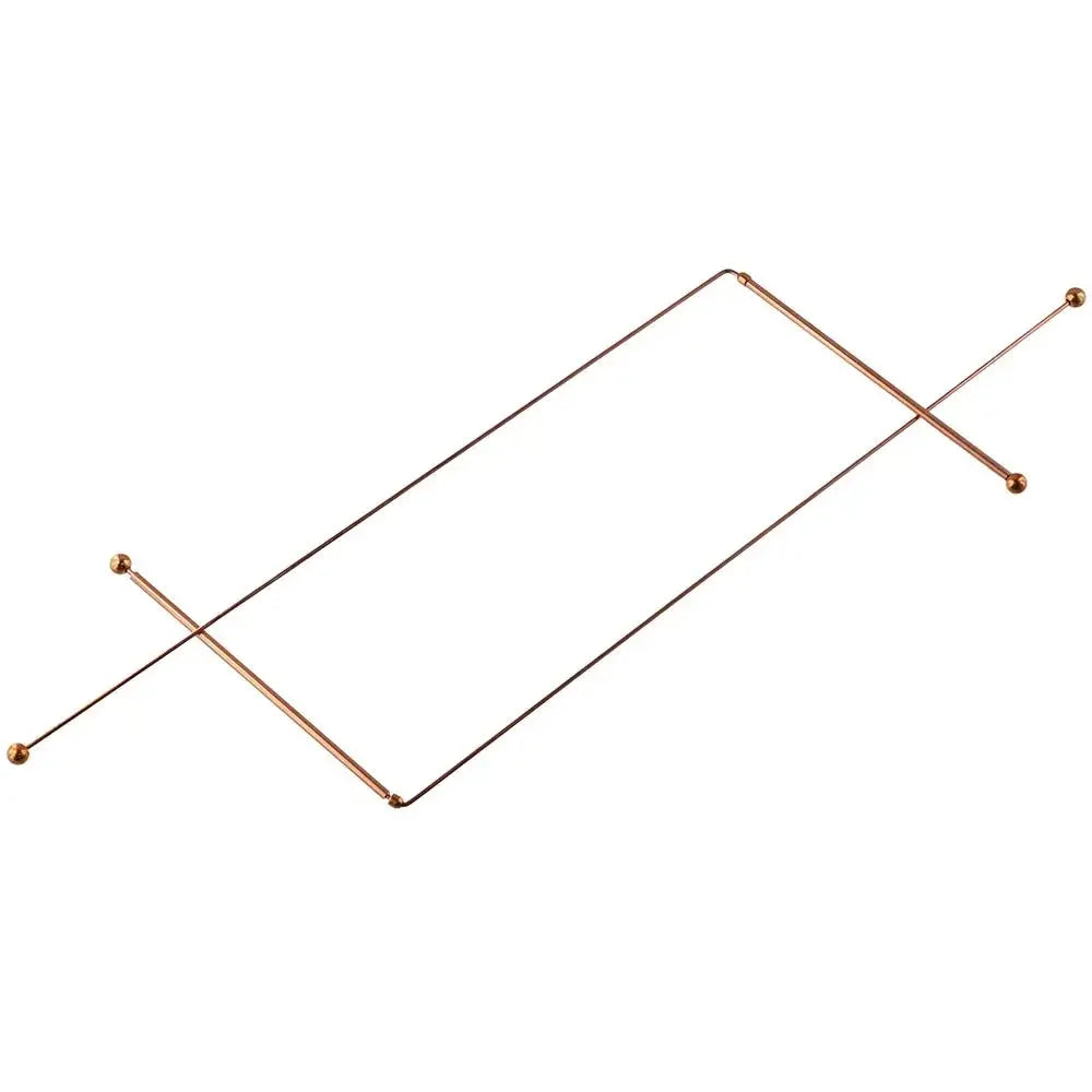 A set of thin copper dowsing rods arranged in a diagonal line.