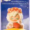 A fluffy, light-colored collectible figure resembling a pony with an orange hat and an orange apple accessory.