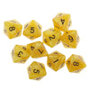 A set of ten yellow acrylic polyhedral dice showing various numbers and shapes for tabletop games.