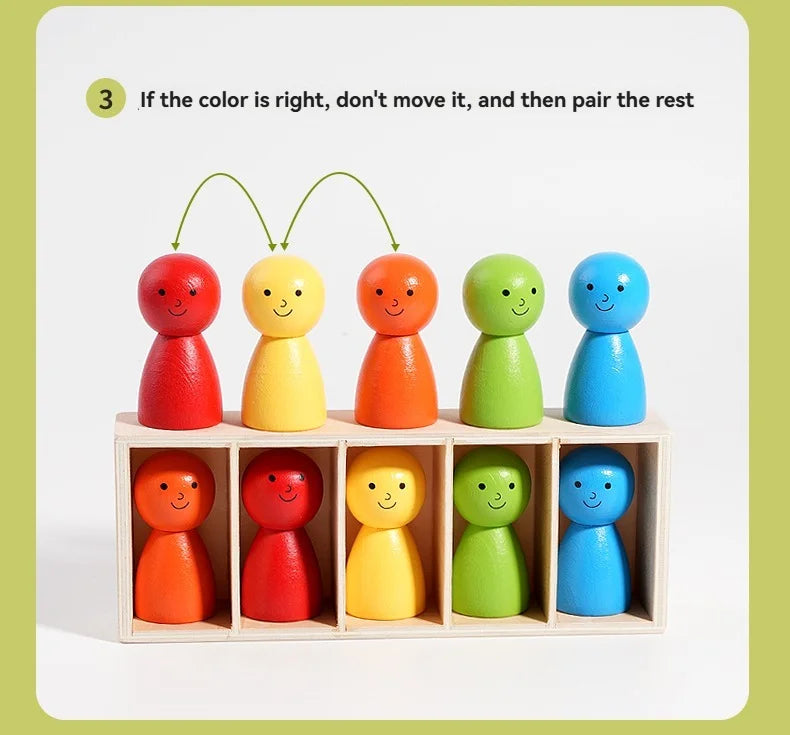 A set of nine colorful, smooth, egg-shaped wooden toys arranged in a grid for color matching practice.