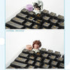 A blind box featuring a collectible keycap with a white and black theme, displayed on a pyramid-shaped base.