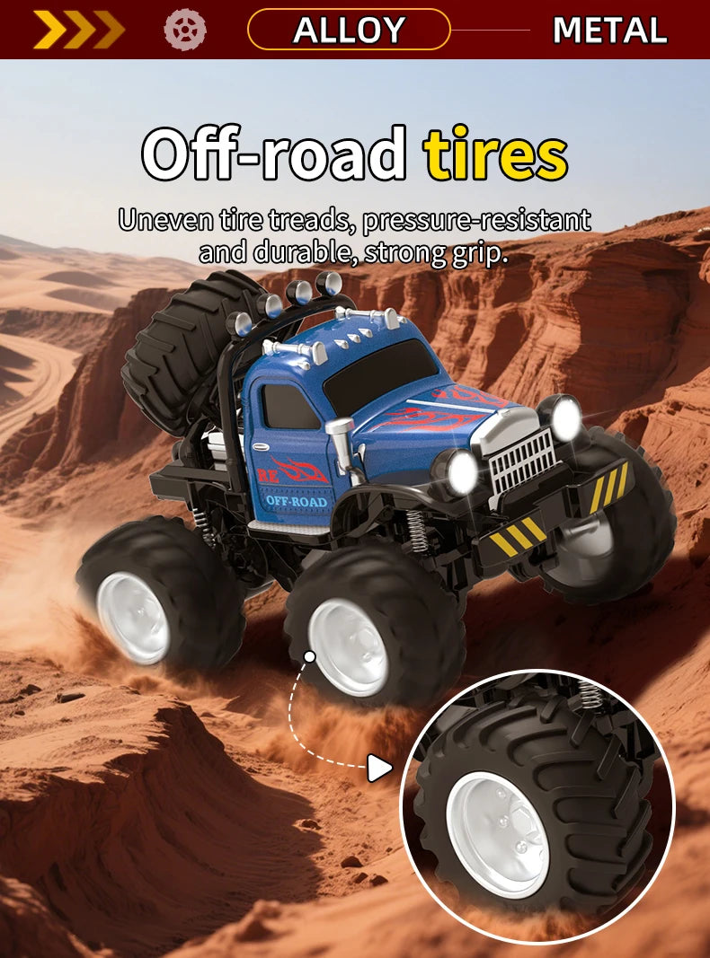 Blue off-road tires on an RC truck driving through sand and dirt terrain.