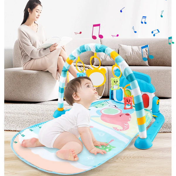 A baby is playing with a colorful musical activity gym that resembles a rainbow arch.