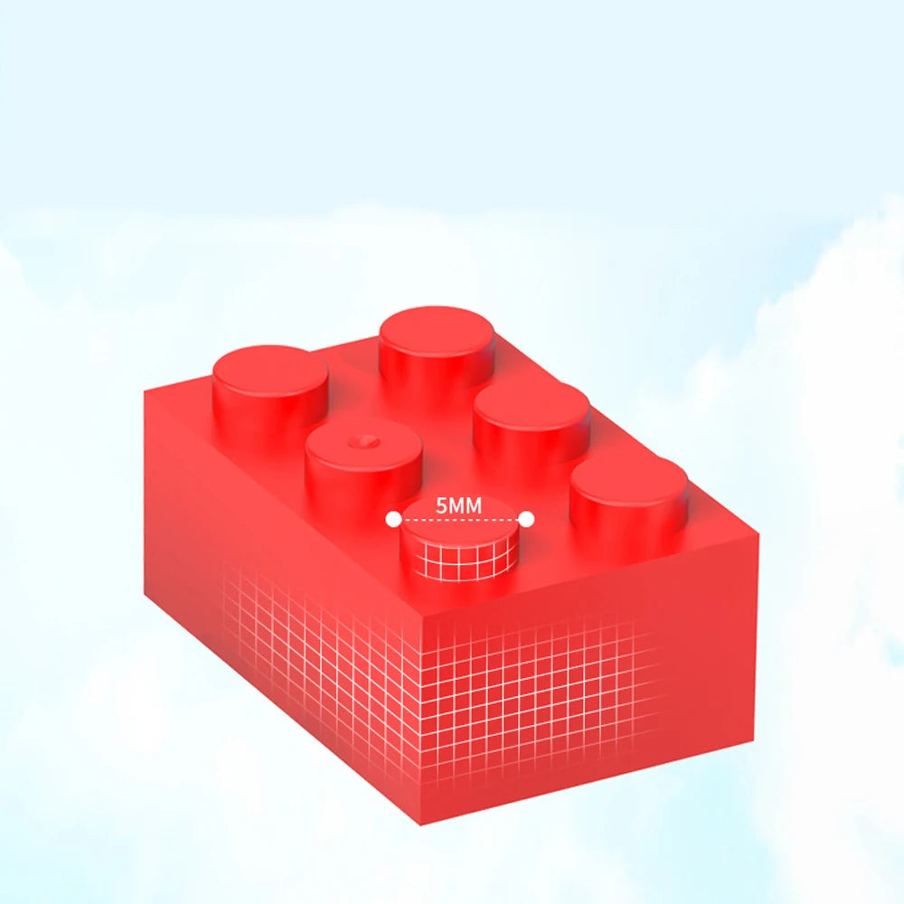 A red building block with a circular indentation marked 5mm, shown against a light blue sky background.