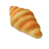 A golden croissant is shown, a realistic bread squeeze toy for stress relief and sensory play.