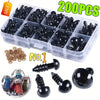 A clear plastic box containing 200 black safety eyes for amigurumi and plush toys, along with loose eyes and a metal eye.