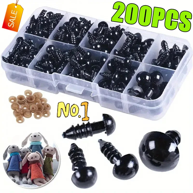 A clear plastic box containing 200 black safety eyes for amigurumi and plush toys, along with loose eyes and a metal eye.