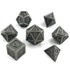 A set of premium metal polyhedral dice in a dark gray finish, including a d6, d8, d10, and d12.