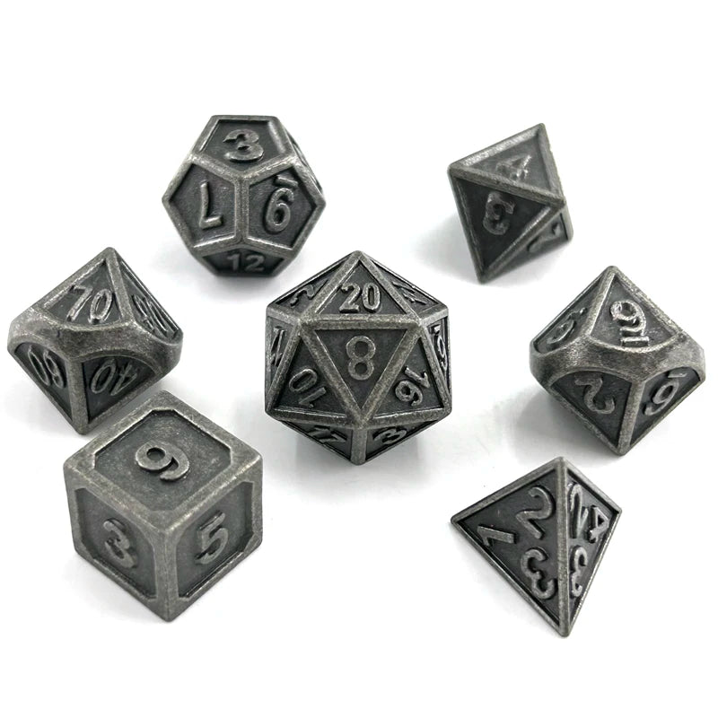 A set of premium metal polyhedral dice in a dark gray finish, including a d6, d8, d10, and d12.