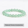 A bracelet made of smooth, light green natural aventurine beads.