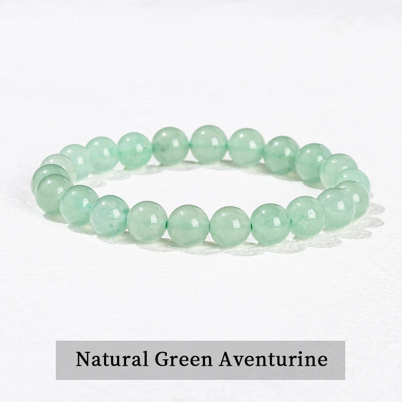 A bracelet made of smooth, light green natural aventurine beads.