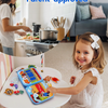 A smiling toddler plays with a blue felt busy board activity book in a bright home setting.