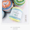 A display of colorful gradient rainbow cotton-wool yarn balls for knitting and crochet.