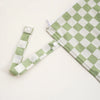 A reusable zippered diaper cover and wet bag featuring a green and white diamond pattern.